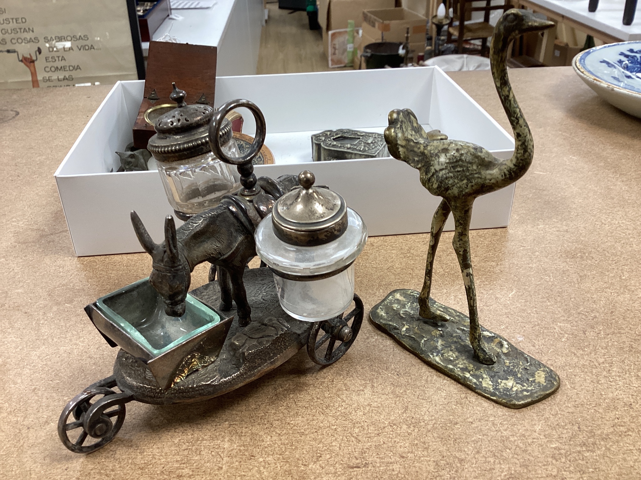 A selection of various miscellaneous items, to include a pair of 19th century cock fighting spurs, a rolled paperwork circular box and cover, a novelty plated donkey cruet, Tibetan box etc.